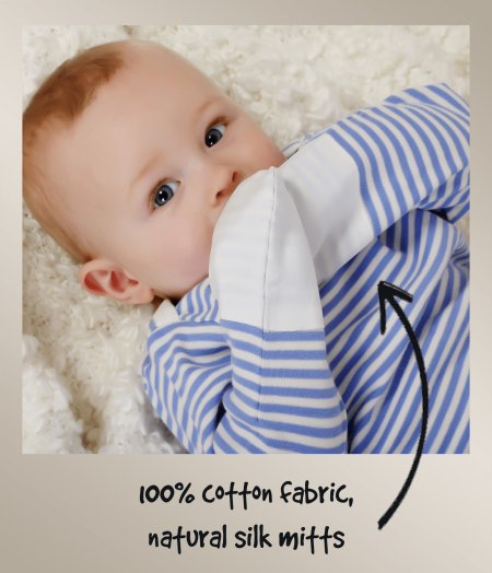Baby boy wearing blue and white striped ScratchSleeves PJs with white integrated silk mittens. Annotated to show how the mitts stop eczema scratching.
